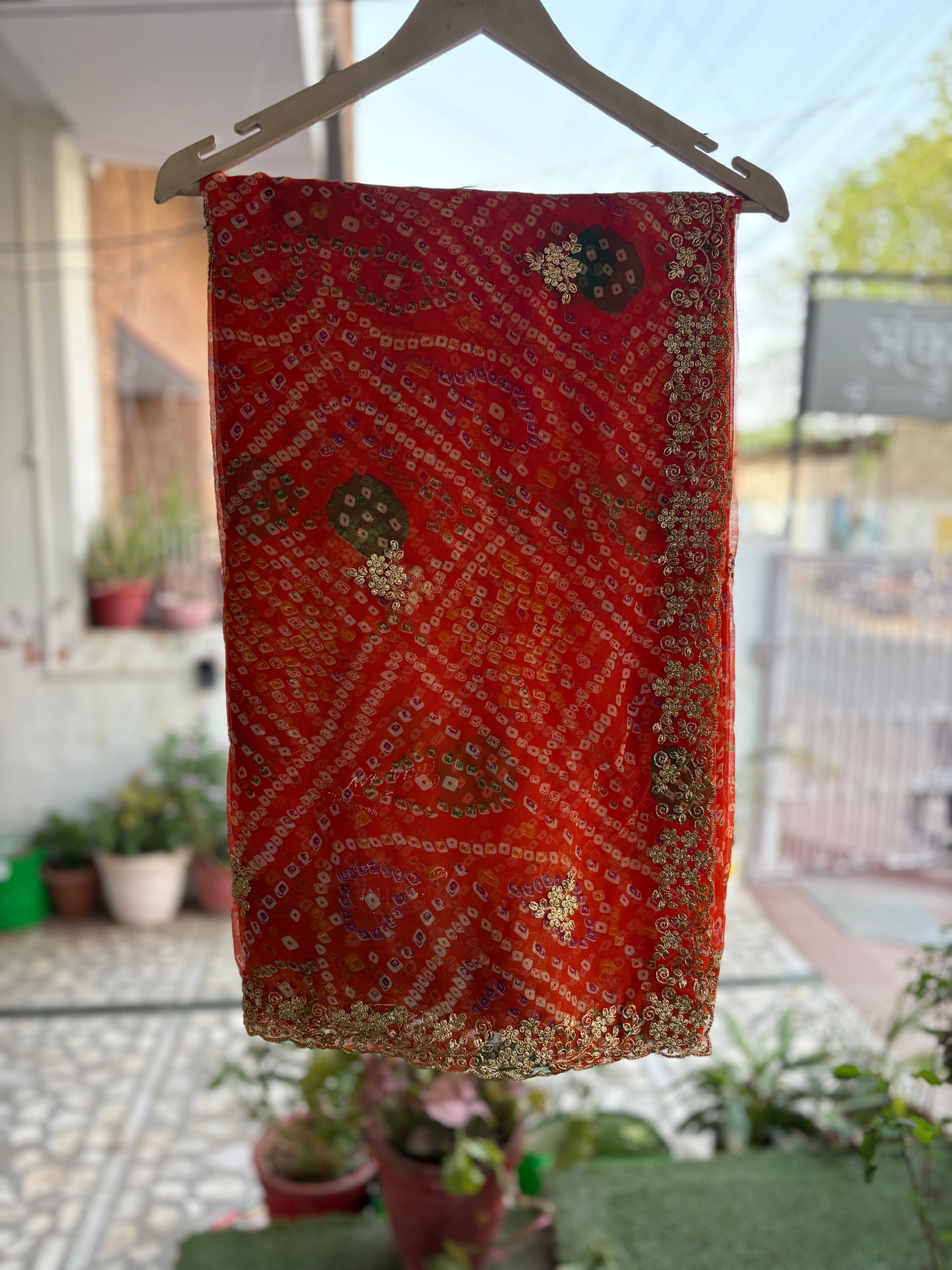 Orange bhandani with Cut work Zari Border